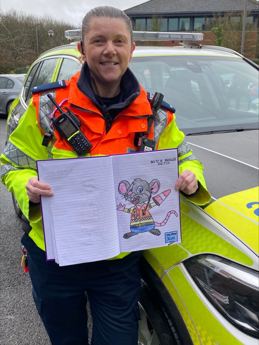 Caption: National Highways traffic officer Kelly Rudge with her illustration book featuring the cartoon creations based on experiences patrolling the Midlands motorway network.