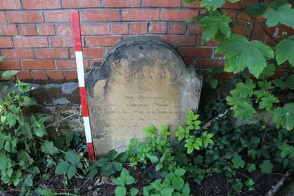 Gravestone with faded inscription