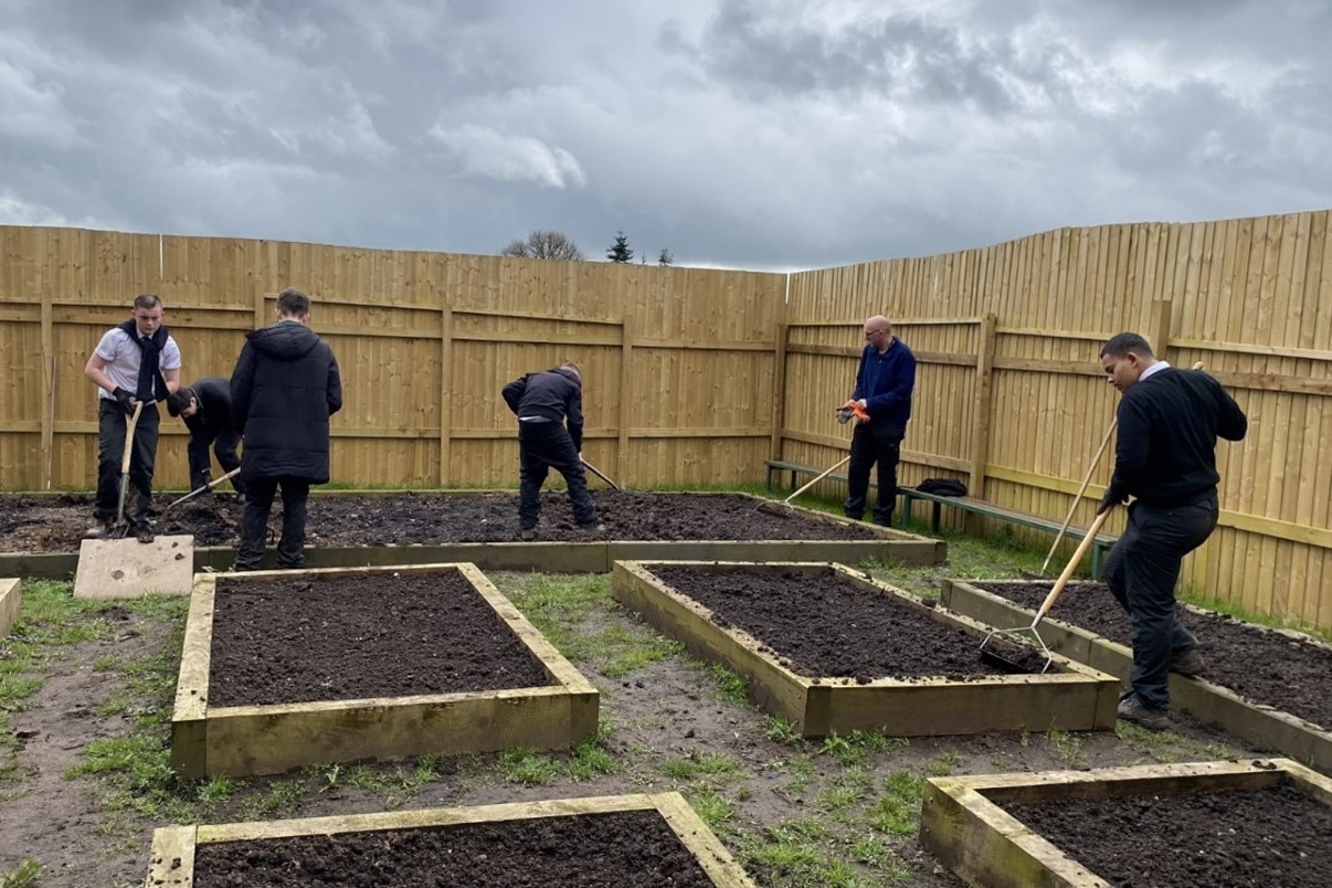 Pupils working in Woodrush School tree nursery