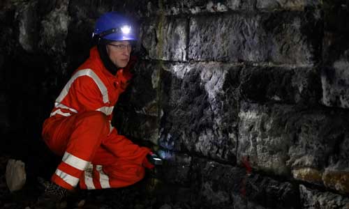 Worker measures distance of the tunnel