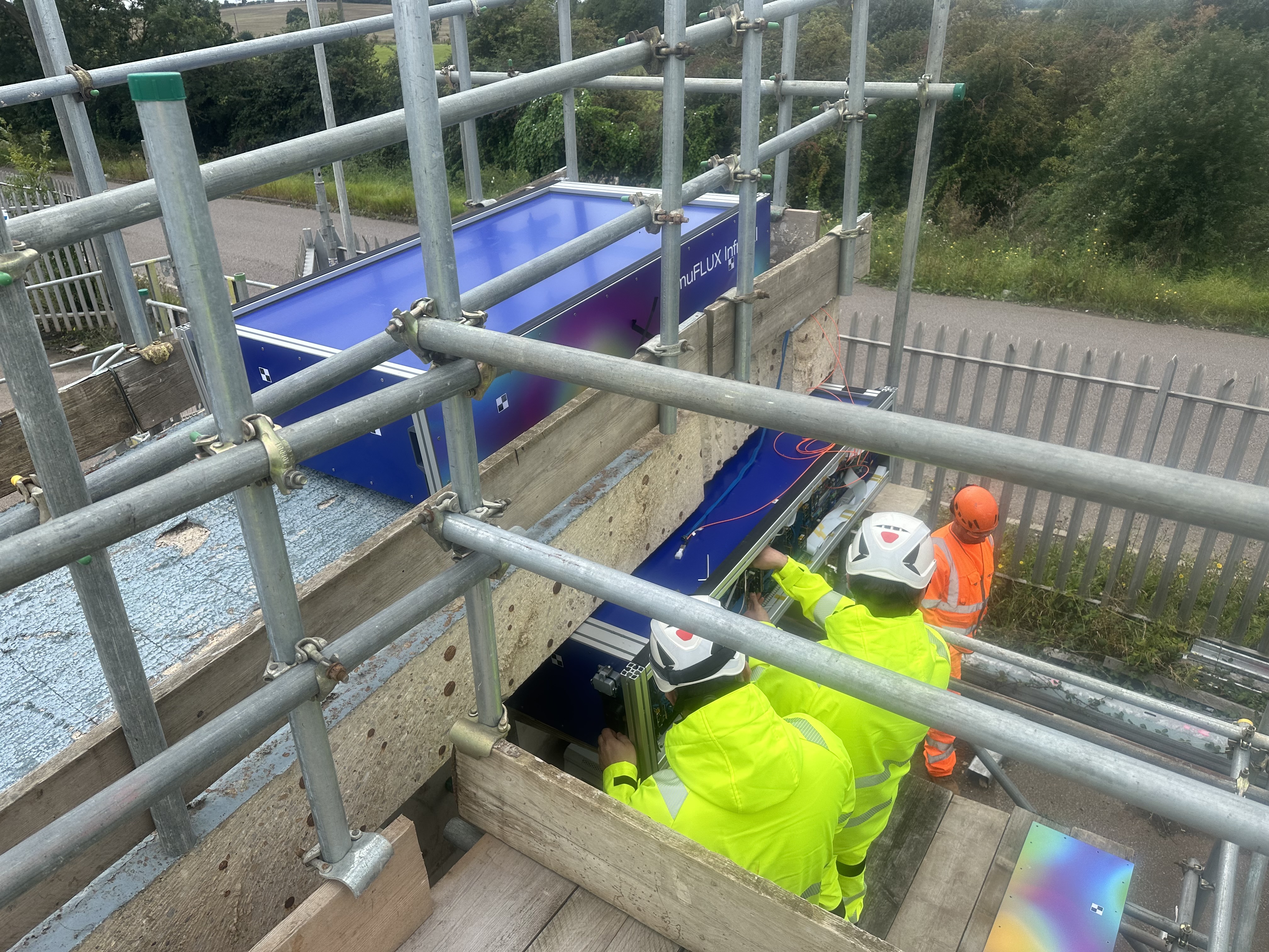 Construction workers using non-destructive testing methods