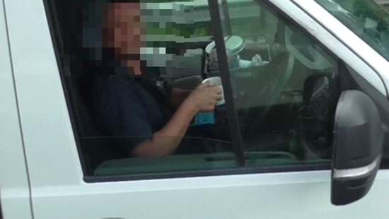 Driver caught sipping mug of tea and removing both hands from wheel by police in unmarked National Highways HGV cab 