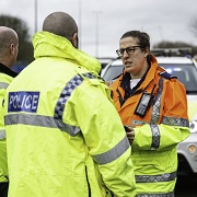 traffic officer talking to emergency services