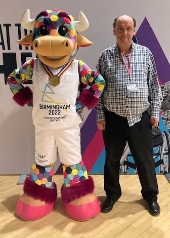 Richard Cullis with Perry the Games mascot