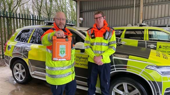 Carl and Mark with the defibrillator