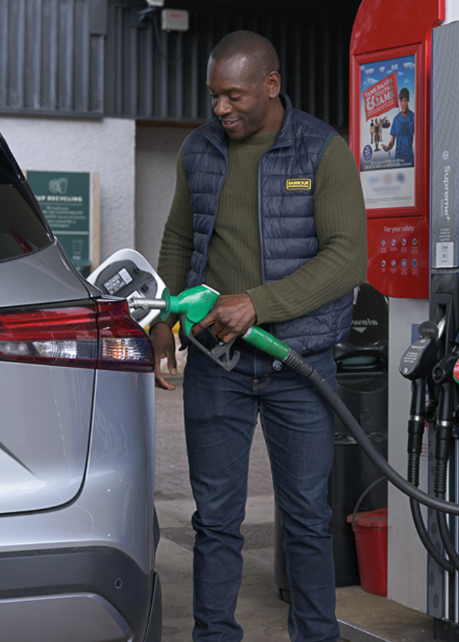 Man putting fuel in his car