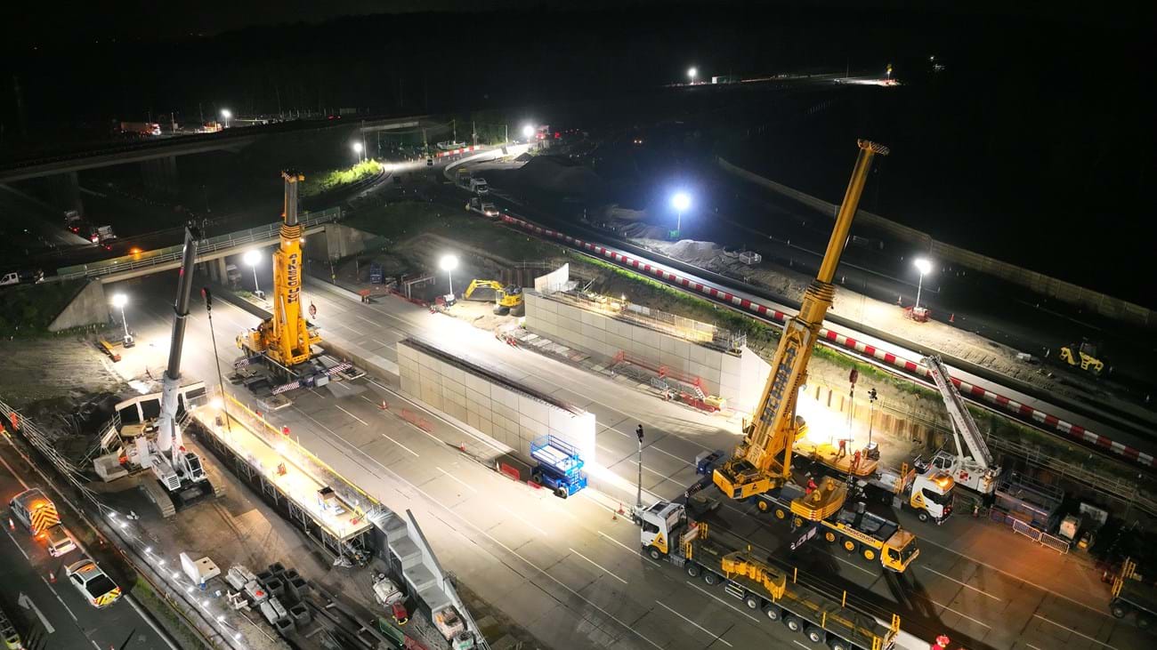 Friday evening: Work under way to rig the cranes that will lift the bridge beams and gantry into place