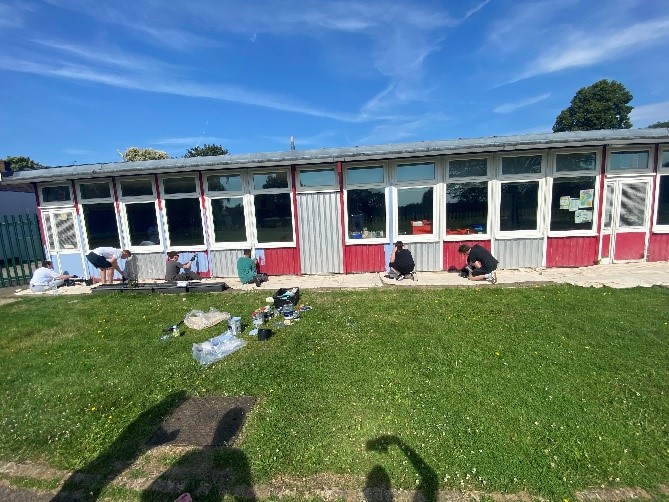 Volunteers painting Drapers Pyrgo school