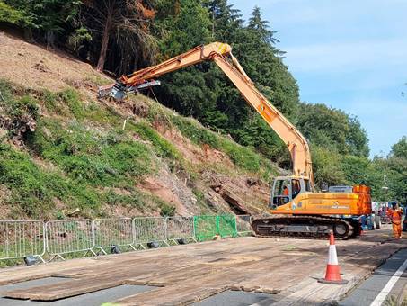 A construction vehicle on a hill

AI-generated content may be incorrect.