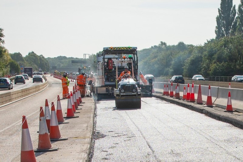 Work in progress overlaying the old concrete surface with the new low noise, asphalt surfacing