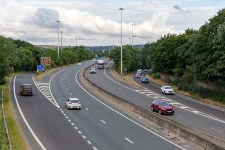 Photo of the M621 motorway near Leeds. Slip roads and carriageway with cars travelling along the route.