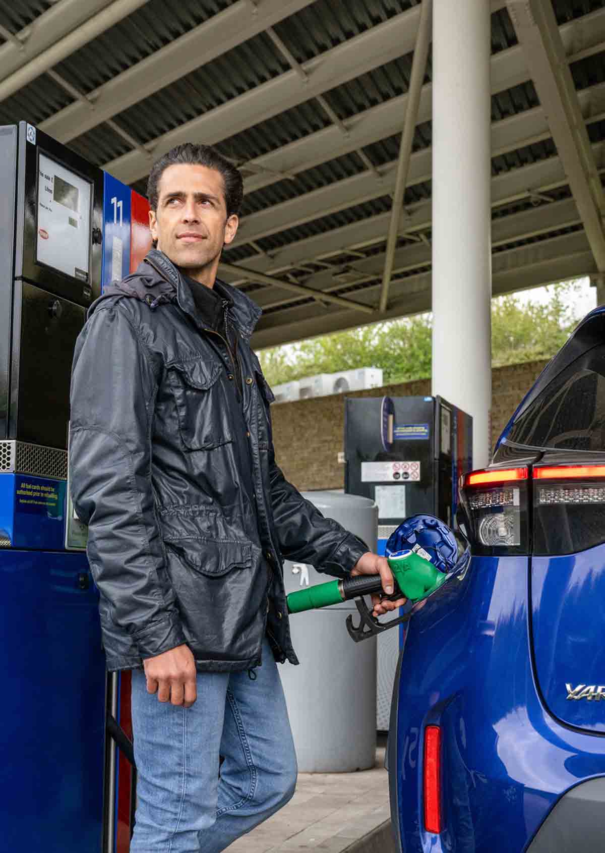 Man filling car up with petrol