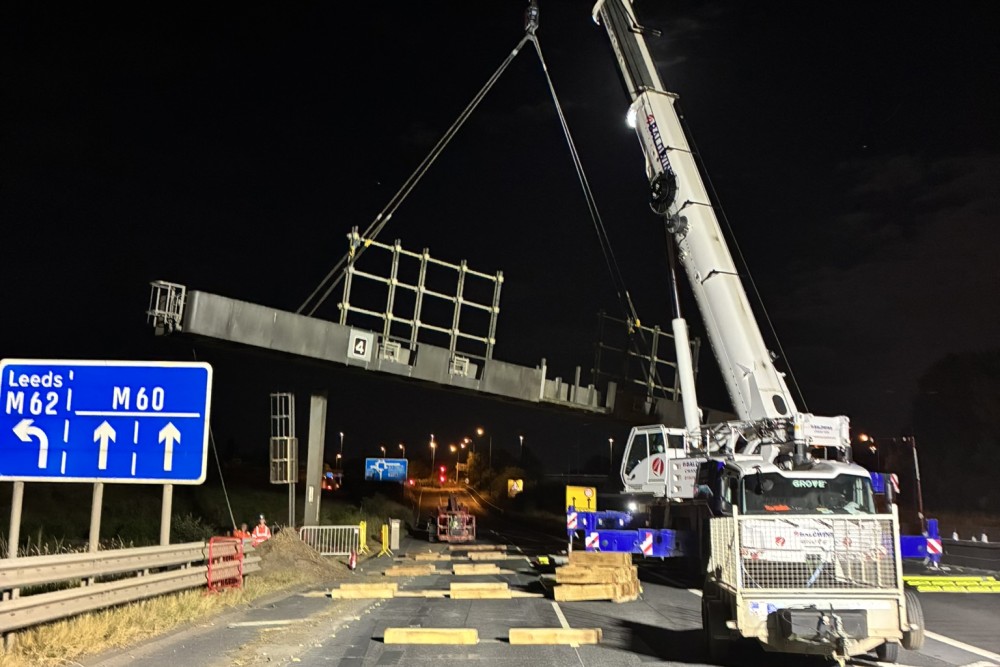 Heavy crane removing a gantry from the M60 during a weekend closure at end July 2026