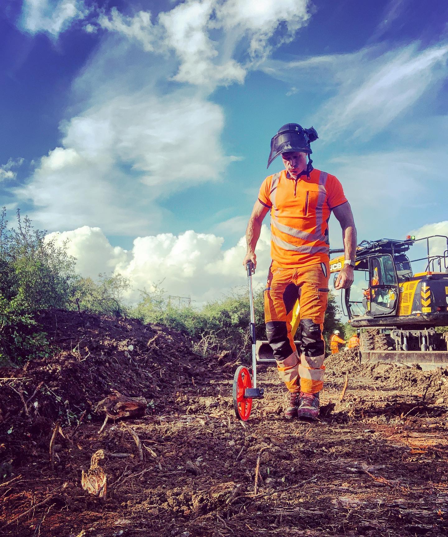 Arborist measuring on site