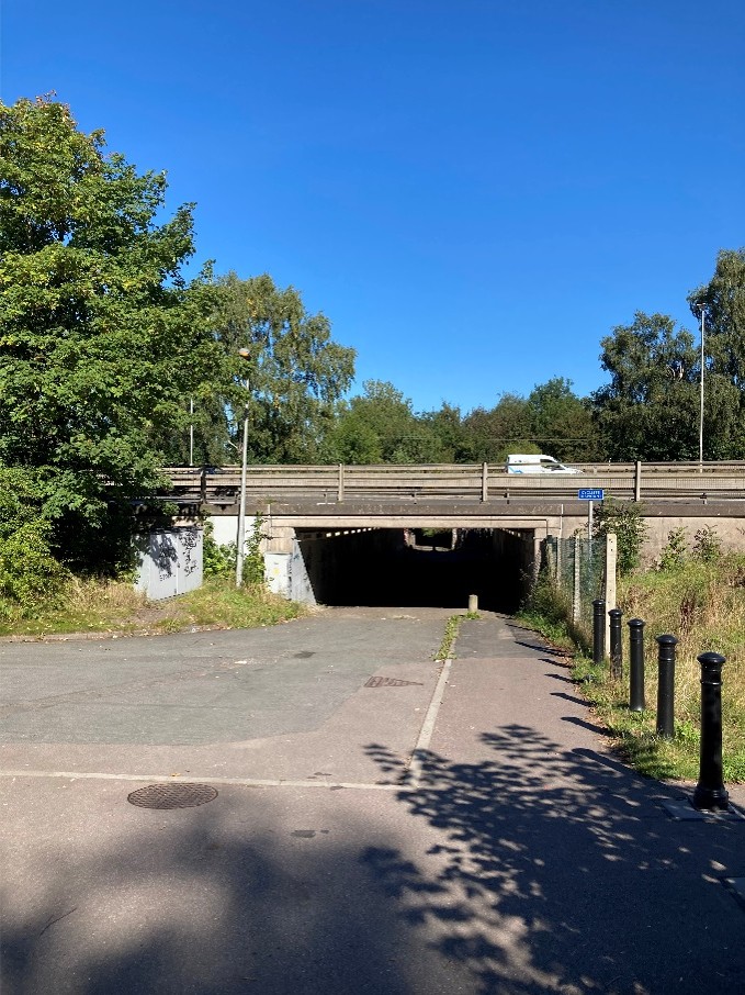 Public Right of Way 83: Existing facility under the A500. Example of new bollards to deter vehicular access to new shared cycle/footpath adjacent to the A500.  Source: site visit September 2024