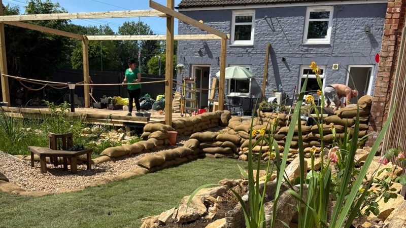 A14 Nene Viaduct team donate materials for veteran centre’s garden transformation