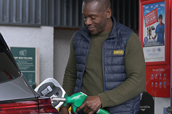 person refuelling his car