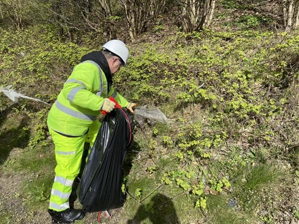 Mike Amesbury MP litter picking along the M56