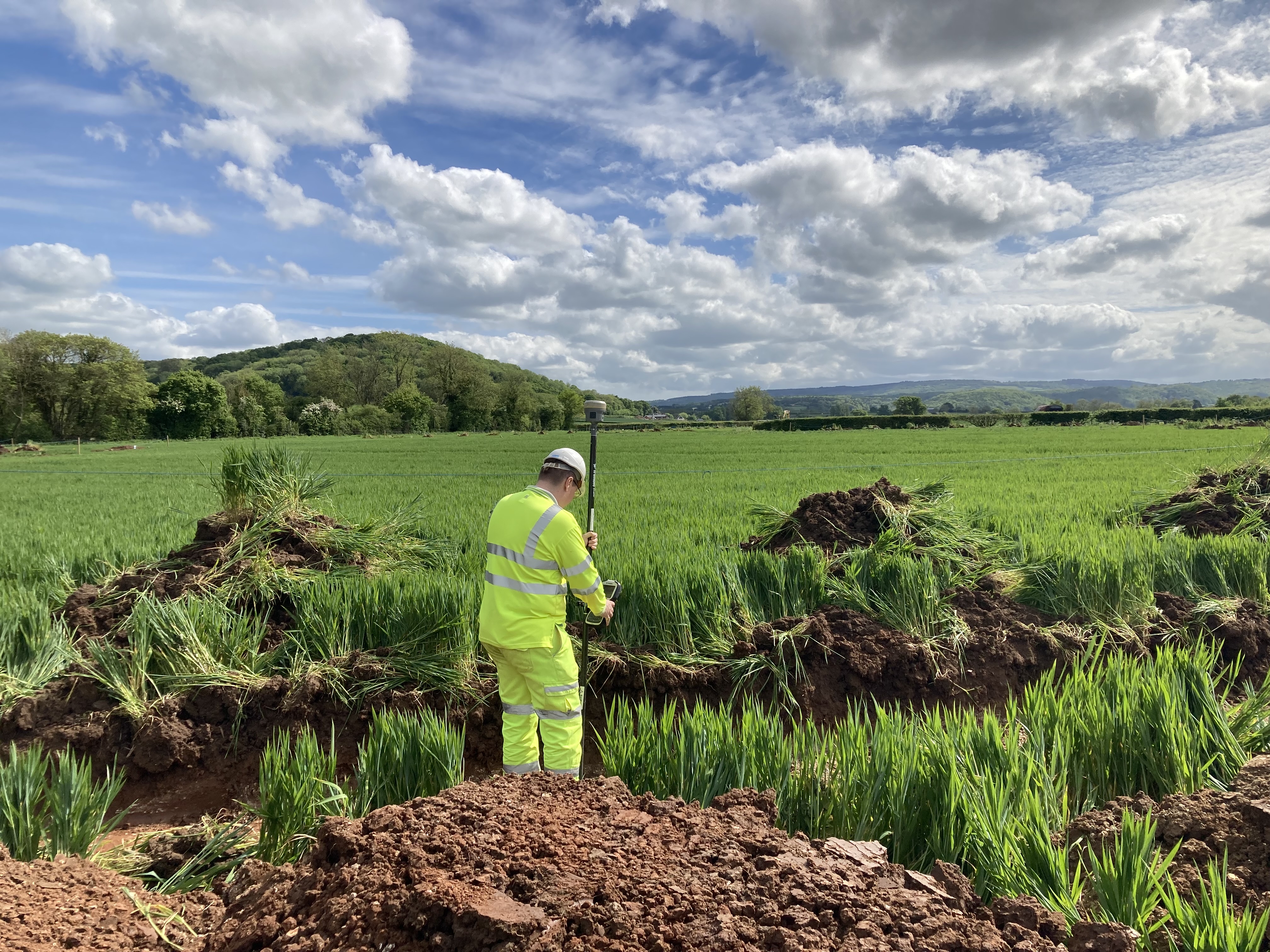 Survey worker trenching