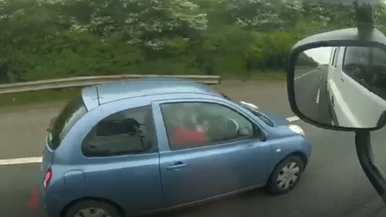 You couldn’t make it up! Shocking footage of driver putting on her make-up at the wheel