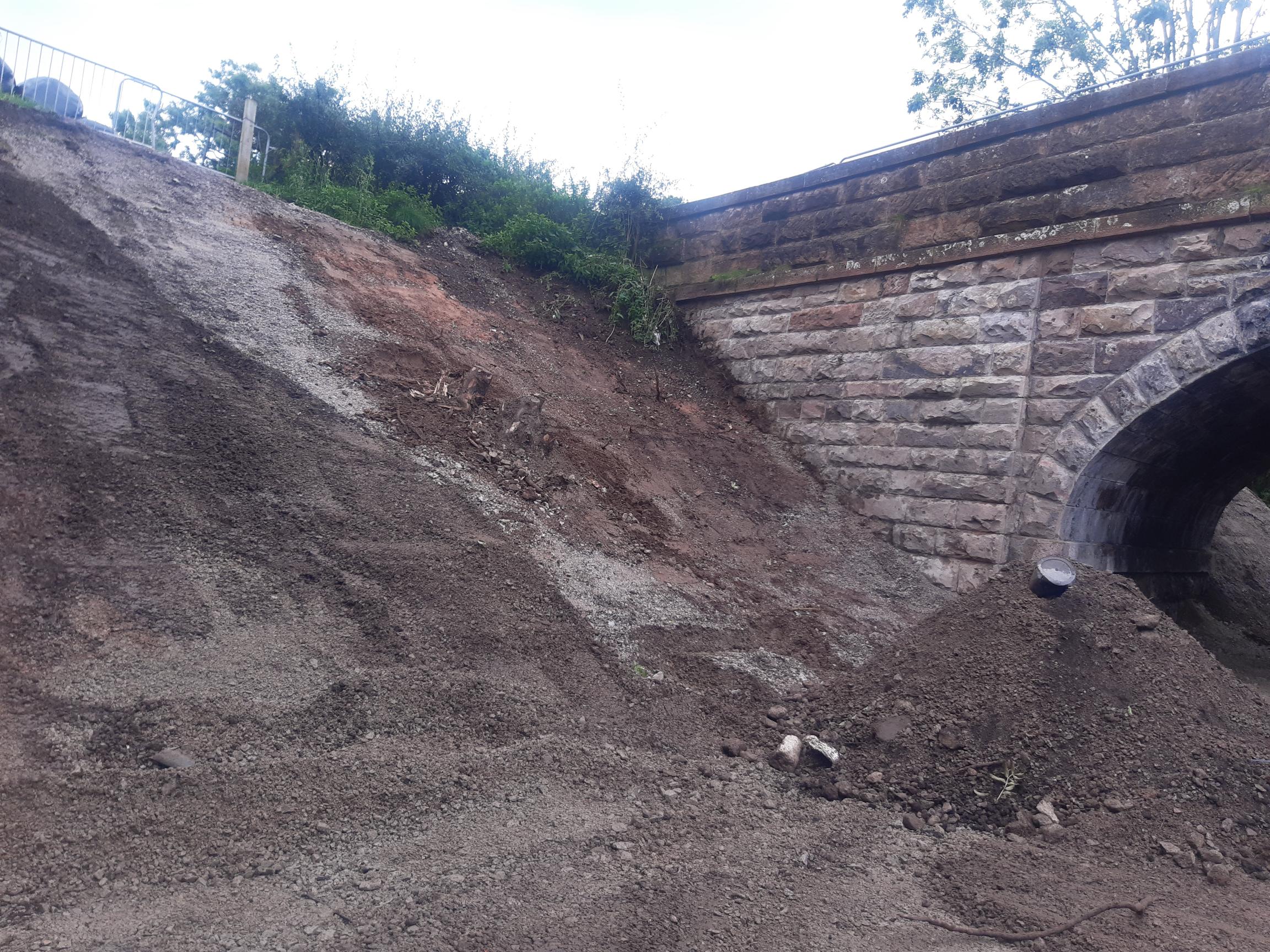 Work to restore old railway cutting slopes to the north side of the bridge