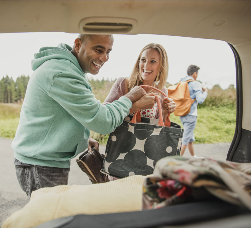 couple unloading car boot